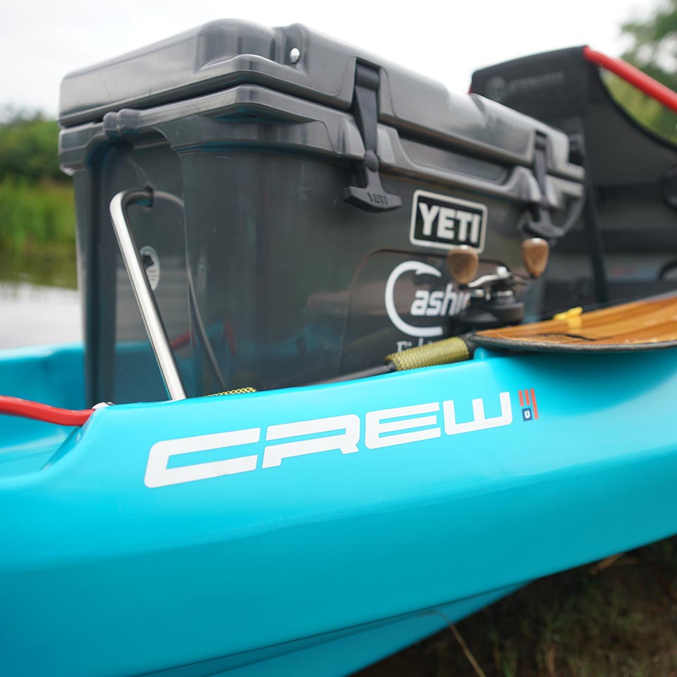 crew kayak camping with yeti